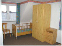 Doppelzimmer mit Kinderbett